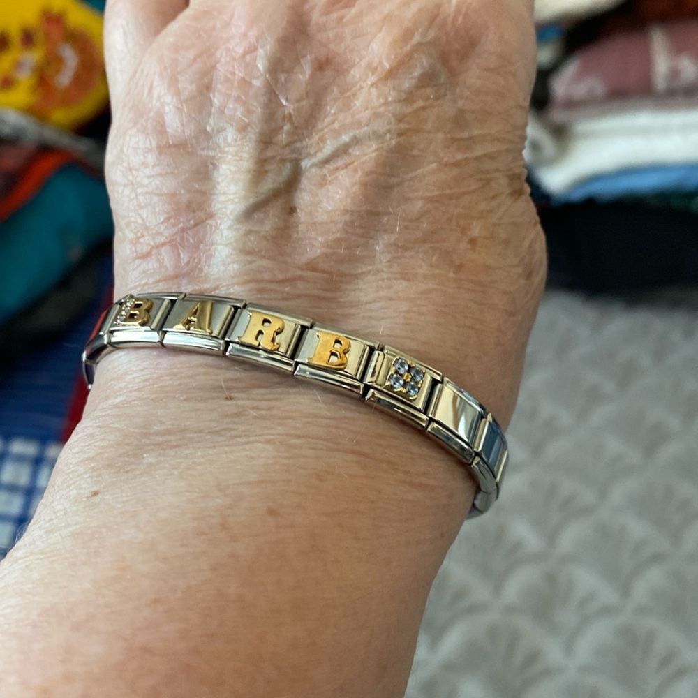 Charm bracelet with spelling “Barb”